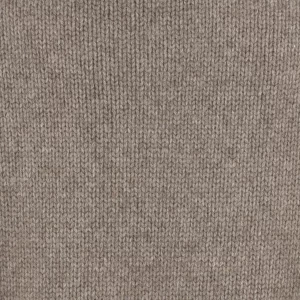 Close-up of beige knit fabric with even vertical ribbing texture.