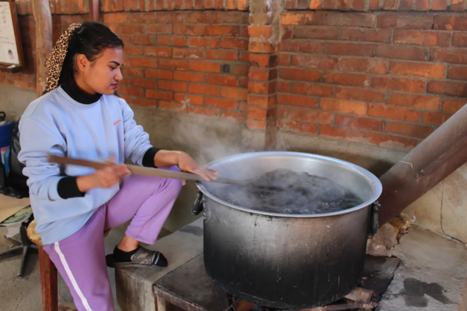 Ochre team member working at the dyeing stage in Kathmandu